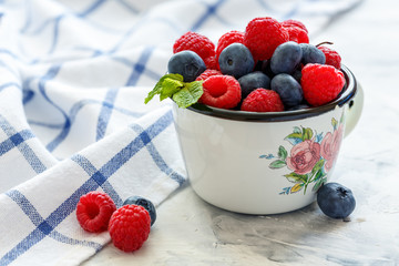 Mug with fresh berries.