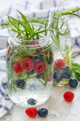 Drink of ripe blueberry, raspberry and tarragon.