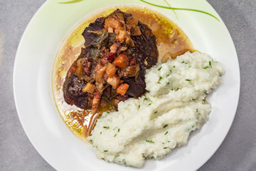 Deer on bacon with mashed cauliflower. Paleo food.