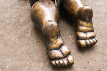 Foot of bronze statue close-up