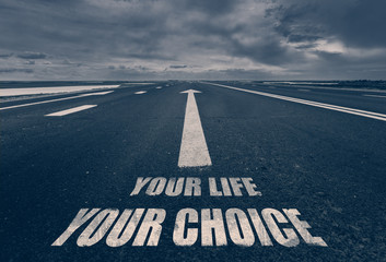 .Your Life Your Choice written on road. Toned.
