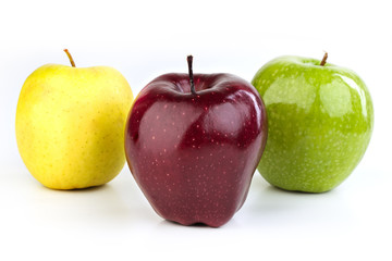 Ripe red and yellow apples on white background