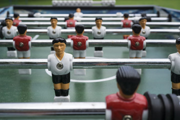 Table football kicker with miniature players