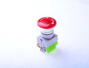 Close-up emergency stop button isolated on white background.