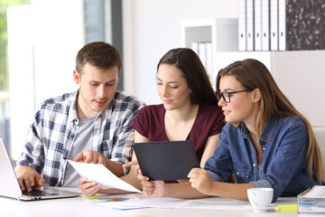 Employees coworking on line at office