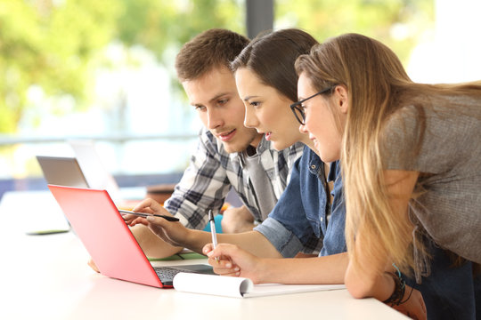 Three students studying together on line