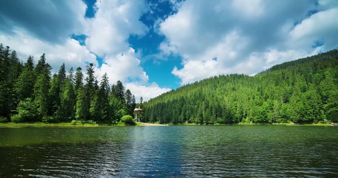 4k high quality timelapse with cloudy sky, beautiful lake Synevir and green mountains, natural outdoor travel landscape