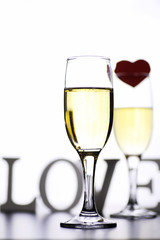 glass of white wine on a table on white background isolate