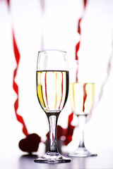 glass of white wine on a table on white background isolate