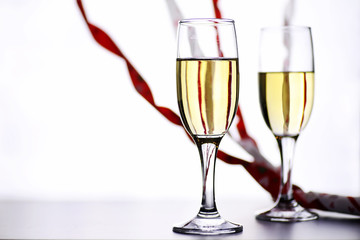 glass of white wine on a table on white background isolate