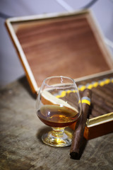 Large box of Cuban cigars on a wooden table