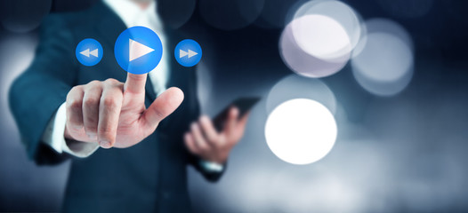 Businessman pressing play button to start or initiate projects