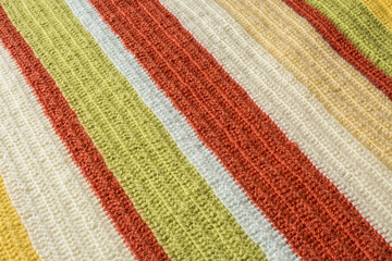Obraz premium Bright warm colored orange and yellow yarn crochet