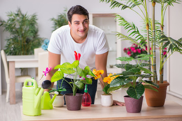 Young man in gardening concept at home