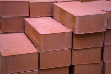 Stack of new red bricks, prepearing for construction a new building