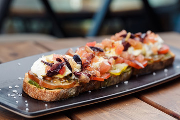 Bruschetta with cherry tomatoes, mozzarella.