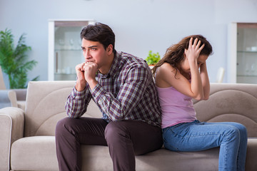 Fototapeta premium Young family in broken relationship concept
