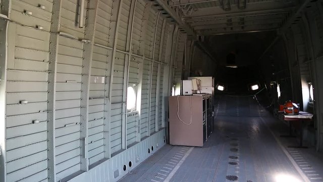 Inside the helicopter. Empty interior of old helicopter. Interior of MI-26 heavy cargo-and-passenger helicopter. Interior of helicopter without passenger seats