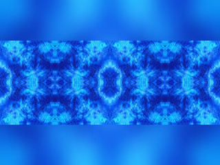 Hand-dyed blue and turquoise fabric with zig zag stitch detail and in a seamless repeat pattern with a band of blurred fabric on the top and bottom edge, with space for text. 