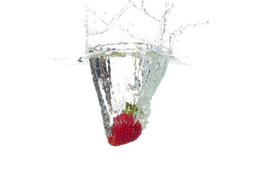 Strawberry falling in the water with splash, isolated on a white background