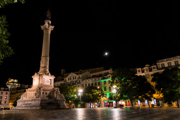 Portugal, Lisbon, Rossio Square by night with Baroque fountain and Column of Dom Pedro IV