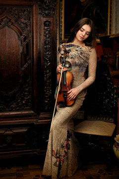 Graceful girl with her violin