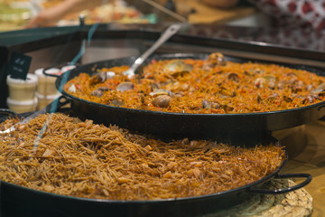 Selling traditional Spanish food cooked at the market