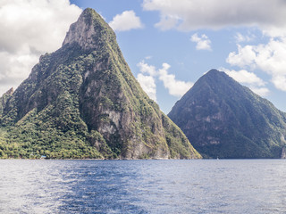 The Piton Mountains, St Lucia. The Pitons ("Peaks" in French) are two mountains, formed from volcanic plugs, above the town of Soufriere. They are the most famous landmark in St. Lucia. 