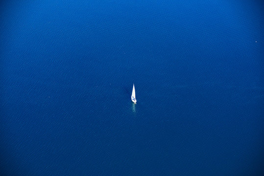 lonely sailor on deep blue water