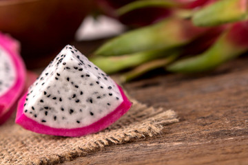 Close up sliced Fresh Dragon fruit or Pitahaya fruit  on the wooden background
