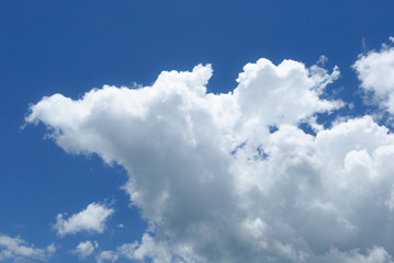 Naklejka na ściany i meble Blue sky with soft white clouds