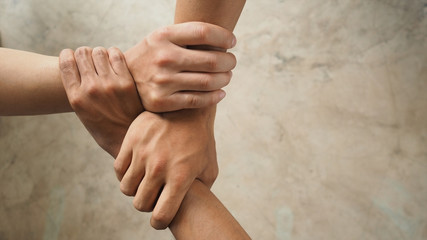 Three human join hands together, collaboration concept of business and education teamwork, soft focus and vintage color tone process - 166935093