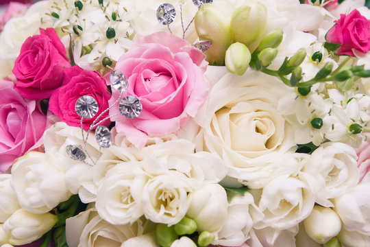 Wedding bouquet made of pink and white roses closeup macro background.