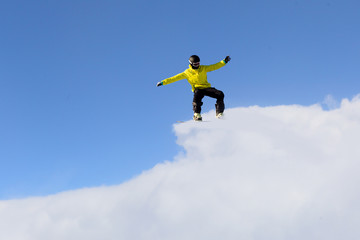 Naklejka na ściany i meble Snowboarder making jump