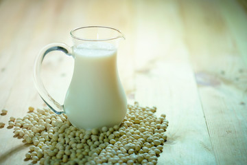 soy bean and soy milk on wood background