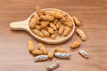 boiled peanuts on wooden plate