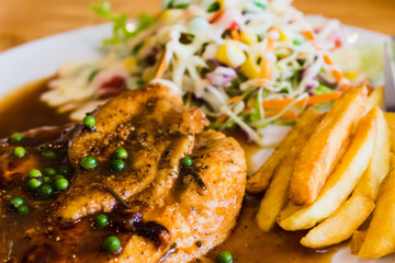steak and sausage with salad