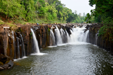 Fototapeta na wymiar Motion and flowing water of Tad Pha Suam waterfall