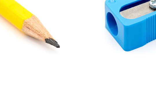 Yellow Penci broken tipl with blue sharpener on white background