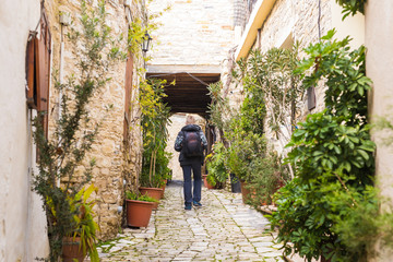 Man traveler with hat and backpack enjoying view