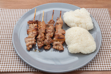 grilled pork skewer chop with sticky rice