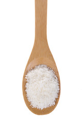 Coconut flakes on a bamboo spoon.