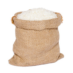 White rice in burlap sack bag isolated on white background