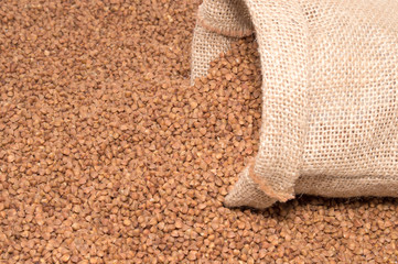 Buckwheat in sack bag  isolated on white background