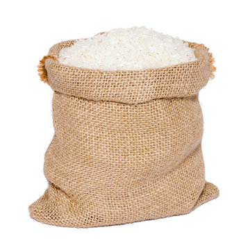 White Rice In Burlap Sack Bag Isolated On White Background