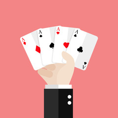 Four aces playing cards in hand