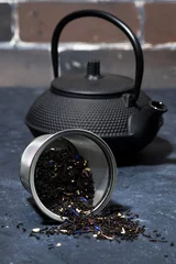 Foto op Aluminium black cast iron kettle and dry tea © cook_inspire