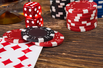wooden table concept of playing poker from chips and cards