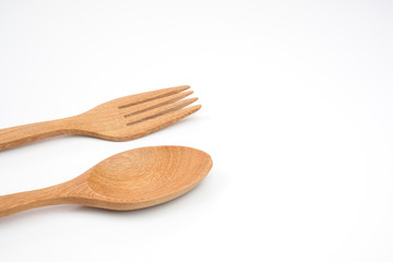 wooden spoon and fork on white background