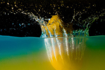 Lemon submerged in water
